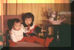 Joan & Grace on a chair